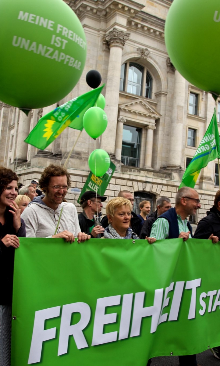 German Green Party supporters marching through the street.