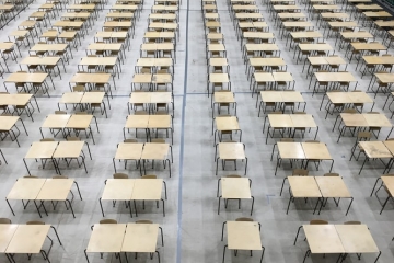 An exam hall filled with desks